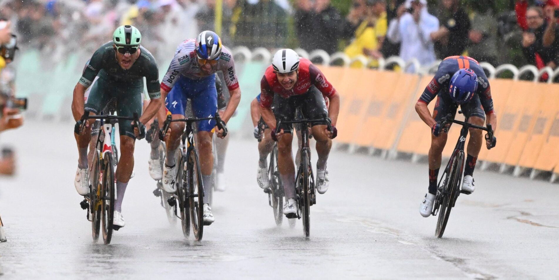 Jonathan Milan Powers to Victory in Rain-Soaked Tour de France Sprint as Crashes Mar Finale