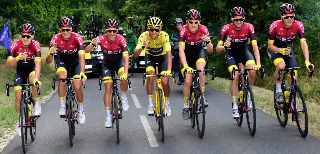 Egan Bernal (on his yellow bike) and his INEOS teammates toast the Tour victory - photo: Fotopersburo Cor Vos